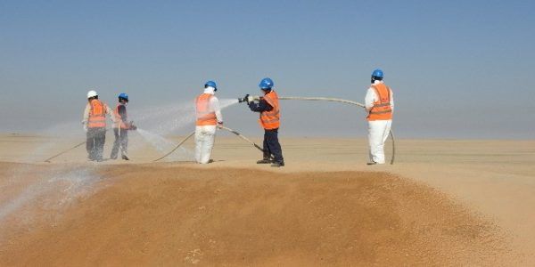 Sand stabilization spraying in the desert